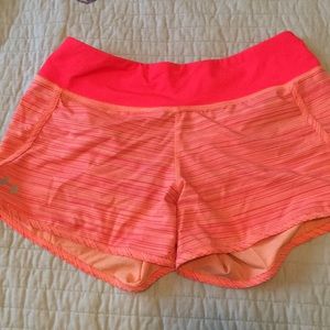 Bright orange Under Armour workout shorts